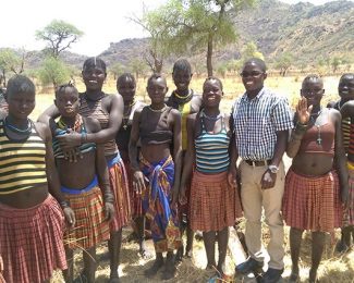 Moses and local community in Uganda inspiring student